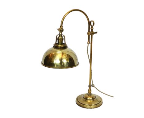 An early 20th century style brass adjustable desk lamp with solid shade, height 52cm
***CONDITION REPORT***A little light oxi