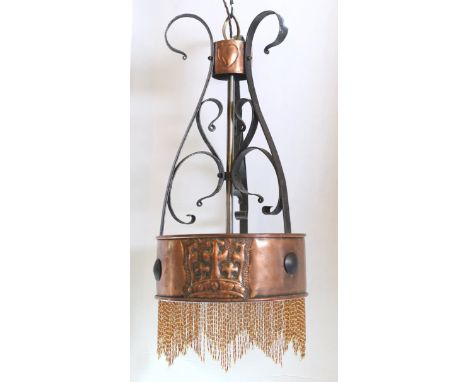 A Scottish Arts &amp; Crafts wrought iron and copper light fitting designed by McKay Hugh Baillie Scott, decorated with styli