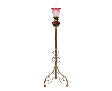 A late Victorian lacquered brass oil lamp standard with ruby glass reservoir and cranberry tinted frosted glass shade, overal