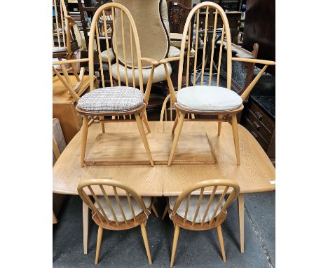 Ercol mid 20th century extending dining table with one leaf, plus six (4+2) stick back dining chairs

All in reasonable used 