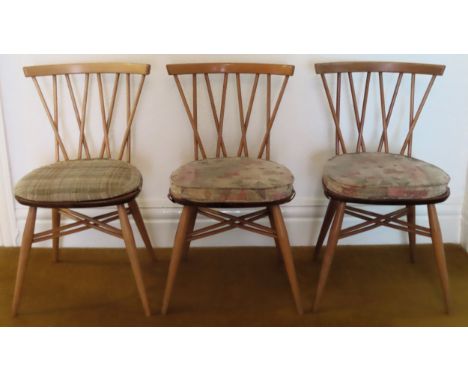 Set of three Ercol mid 20th century stylish stickback chairs. Approx. 78cm H

Reasonable used condition, scuffs and scratches