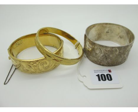 A Wide Hallmarked Silver Hinged Bangle, leaf scroll engraved to the front (hinge broken); together with a 9ct gold metal core