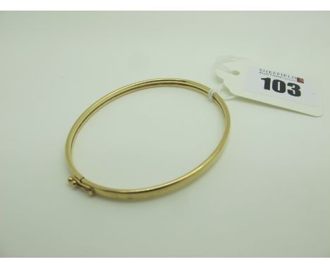 A Dainty 9ct Gold Bangle, of plain design. 