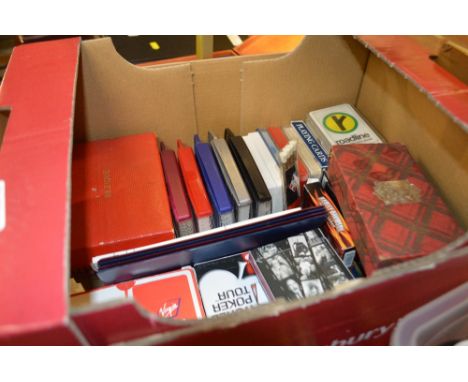 A box containing various playing cards and Bezique Bridge
