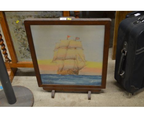 An oak framed firescreen, painted with a scene of a three masted sailing ship