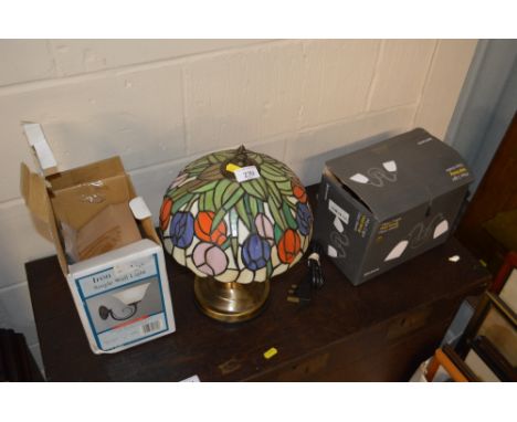 A Tiffany style table lamp and shade; and two boxes containing wall lights 