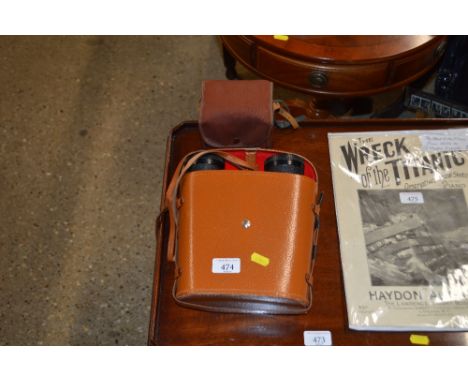 A pair of Nipole Charles Franck binoculars 10 x 50 with carrying case and a box camera