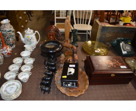 A quantity of various carved wooden items to include a bowl on stand; ebony elephants; hard wood trinket box; a bust etc.