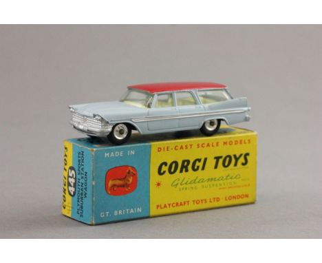 Boxed Corgi 445 Plymouth Sports Suburban Station Wagon with hite body and red roof, yellow interior, diecast excellent, box g