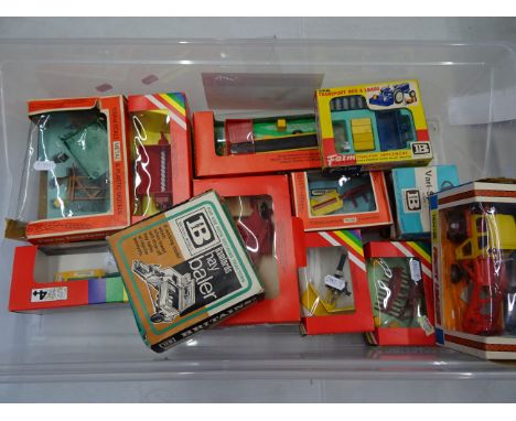 Twelve boxed Britain's farming vehicles & implements to include 9572 Massey-Ferguson Front Loader Tractor, 9563 Hay Baler, 95