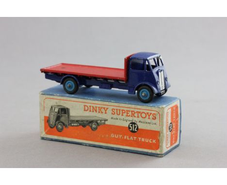 Boxed Dinky Supertoys 512 Guy Flat Truck in dark blue cab, red flatbed and light blue hubs with some paint loss, good overall