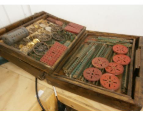 Wooden box of vintage Meccano containing various pieces