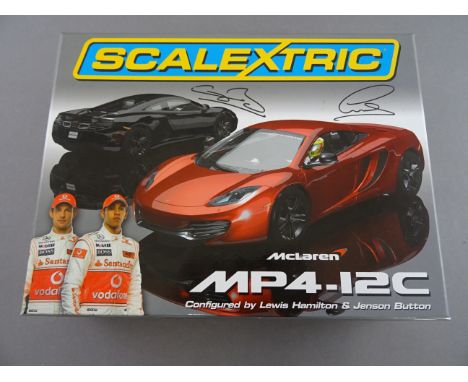Boxed Scalextric ltd edn McLaren MP4-12C Lewis Hamilton and Jenson Button with certificate card