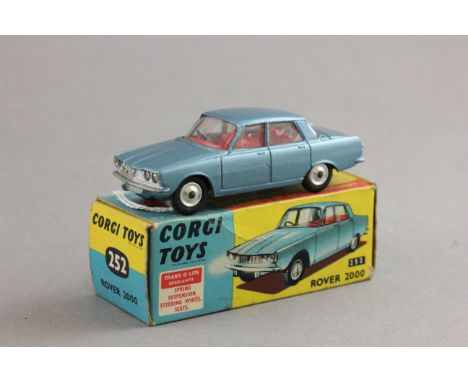 Boxed Corgi 252 Rover 2000 in metallic blue with red interior in gd condition overall with a few scratches to paint work