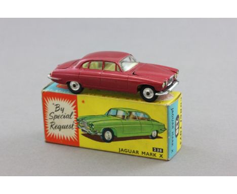 Boxed Corgi 238 Jaguar Mark X 'By Special Request' in metallic cerise complete with suitcase, diecast excellent with minor pa