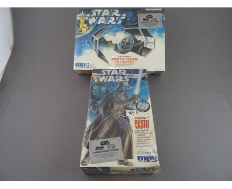 Two boxed ERTL Star Wars Commemorative Edition model kits to include 8154 Darth Vader & 8916 Tie Fighter.  Both unused & in o
