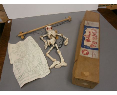 Boxed Pelham Puppet of a Skeleton in gd condition with strings a little tangled (should be able to untangle) and a fair/tatty