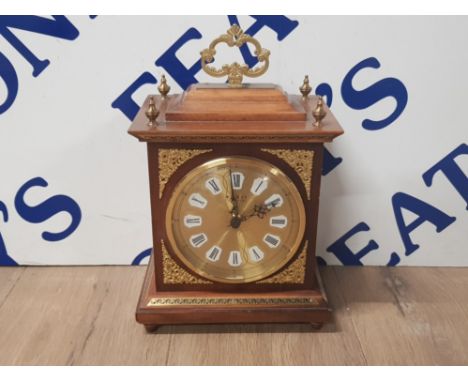 A REPRODUCTION GILT MANTLE CLOCK