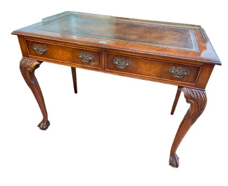 Chippendale style walnut two drawer writing table on ball and claw legs, 78.5cm by 106cm by 59cm.