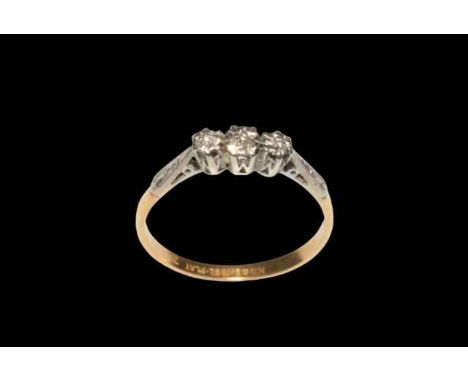 18 carat gold and platinum three stone diamond ring, size T.