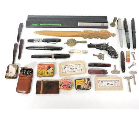 A collection of fountain pens, including Bayer and Pelikan, marked 14k, record player needles, a tortoiseshell style notepad,
