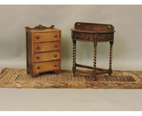 An early 20th century oak demi lune with barley twist legs, a four drawer chest and a carpet runner - possibly to be separate