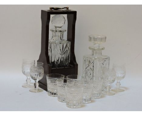 Four Crystal white wine glasses, six crystal tumblers, a decanter and a single bottle tantalus