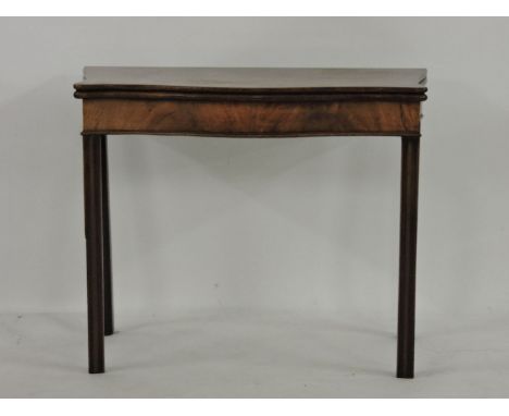 A George III mahogany serpentine fold over card table, raised on moulded front legs, 90.5cm wide