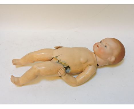 An Armand Marseille baby doll, with a bisque head and papier mâché body, impressed 'AM Germany 341/6/K', body with damage