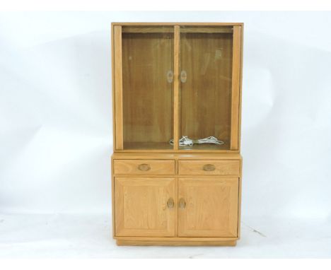 A modern Ercol light elm cabinet, glazed upper section over cupboards beneath, 91cm wide