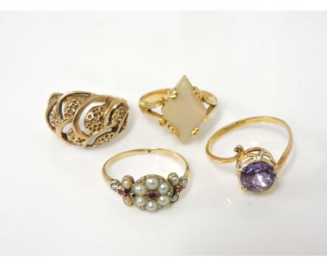 An Indian gold mother of pearl lozenge ring, marked 22ct, tested as approximately 18-20ct, 5.0g, an Indian gold amethyst ring