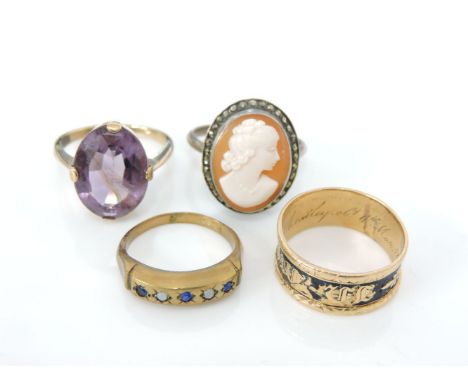 A Georgian 18ct gold memorial band ring, with black enamel, a gold oval cut amethyst ring, a five stone blue and white stone 