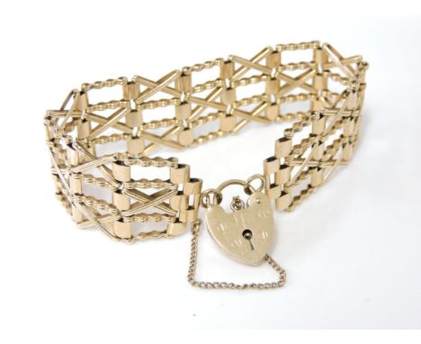 A 9ct gold four row crossover gate bracelet, with 9ct gold padlock, 19.8g
