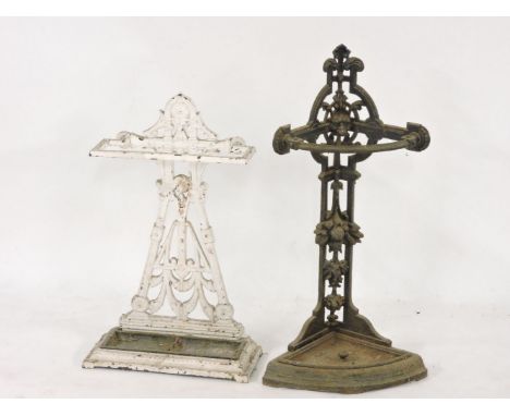 A Victorian cast iron corner stick stand, 77cm high, and a white painted example, 65cm high