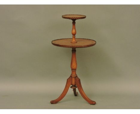 A satin birch two tier lamp table, c.1900, with inlaid strung and key decoration, on down swept legs, 76cm high