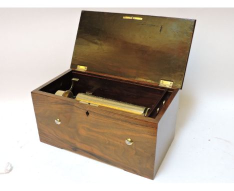 A late 19th century Swiss music box, playing four airs, with hidden drum and three bells, within a walnut case, drum 23.5cm