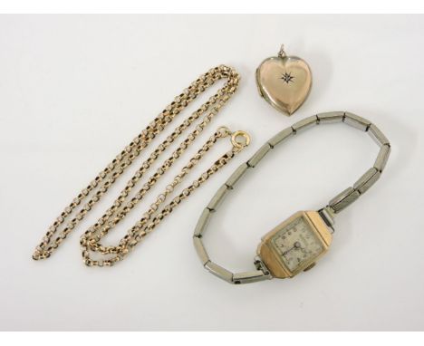 A gold belcher chain, marked 9ct, 4.0g, a front and back heart shaped locket set with a single diamond, 3.1g, and a gold ladi