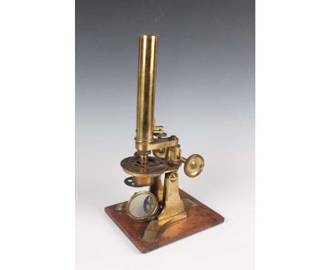 A late 19th century gilt lacquered brass monocular microscope, signed 'Baker 244 High Holborn London', with rack and pinion f