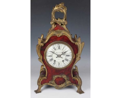 A late 19th century French gilt metal and red tortoiseshell mounted balloon cased mantel clock with eight day movement striki