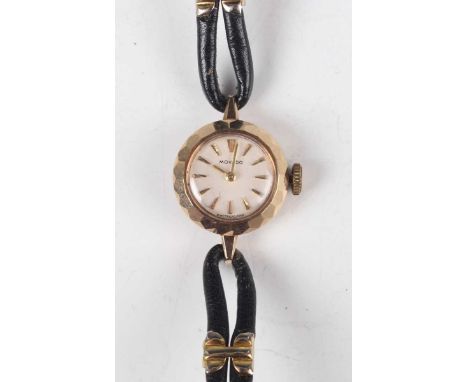 A Movado 9ct gold circular cased lady's wristwatch with signed and jewelled movement, the signed silvered dial with gilt tape