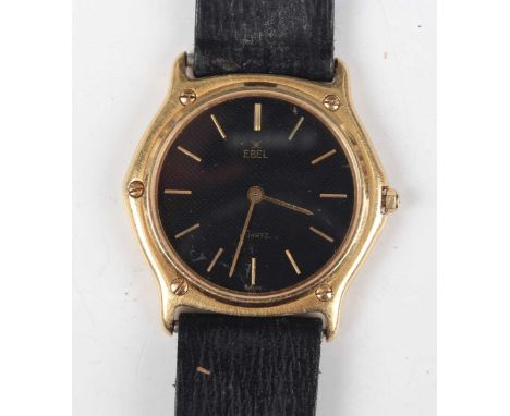 An Ebel Quartz 18K gold cased gentleman's wristwatch, the signed black dial with gilt baton hour markers, the case back detai