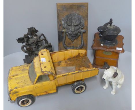 A vintage brass door knocker, Tonka truck, coffee grinder and one other 