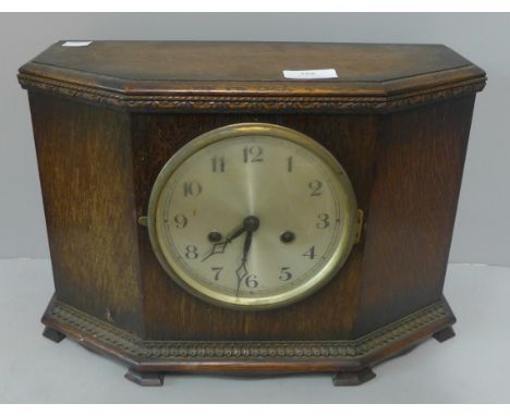 An early 20th Century oak mantel clock 