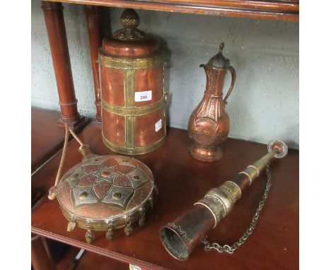 Middle Eastern copper and brass wares, including hunting horn, flask, large container and coffee pot.