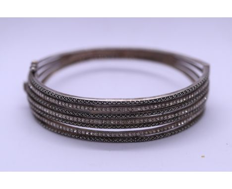 Unusual silver stone set bangle 