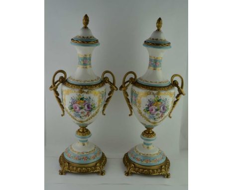 A PAIR OF LATE 20TH CENTURY CONTINENTAL POTTERY VASES, with gilt mounts, of urn form with acanthus leaf handles, marked "Ace 