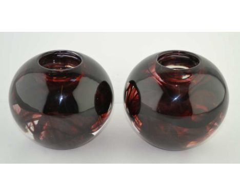A PAIR OF "KOSTA BODA" SMOKEY GLASS NIGHT LIGHT HOLDERS, of globular form, inscribed to bases, 9cm high 
