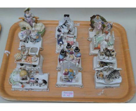 A COLLECTION OF TWELVE LATE 19TH CENTURY CONTINENTAL CERAMIC "FAIRINGS", to include "Tug of War", 7cm high (12) 