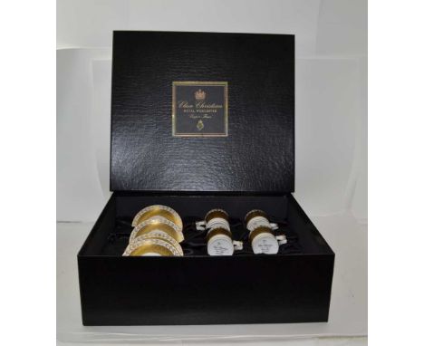A ROYAL WORCESTER CLIVE CHRISTIAN CERAMIC PRESENTATION BOX OF FOUR COFFEE CANS & SAUCERS, gilded "Empire Flame" design in ori