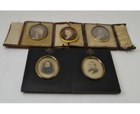 COLLECTION OF FIVE FAMILY PORTRAIT MINIATURES, photographic and painted, late 19th century and mid 20th century, two in leath